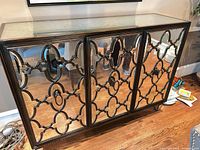 Front view showing mirrored doors and overall design