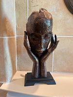 front view of sculpture on base