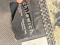 Chilewich brand tag and mat edge showing weave detail