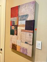 Front angled view of the abstract gallery-wrapped canvas hanging on wall