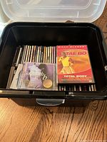Open tote showing CDs and Tae Bo DVD