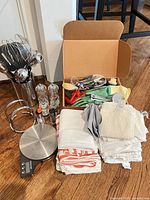 Overall lot with scale, utensil holder, grinders, towels, tool box
