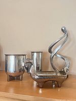 Group shot showing all four metal decor pieces together