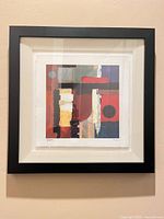 Front view of framed abstract giclée print showing artwork, mat and black frame