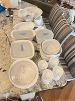 Overview of entire dinnerware and serveware pieces laid on countertop