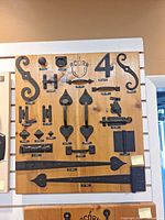 Full view of wooden board with all black iron hardware samples