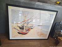 Front view of framed seascape boats print
