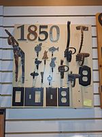 Front view of hardware display showing numbers, hooks, brackets and switch plates