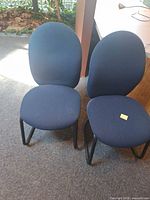 Front view of two blue fabric guest chairs