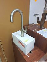 Overall view of Franke gooseneck faucet on display block