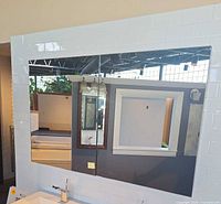 Front view of the two mirrored cabinets mounted side by side