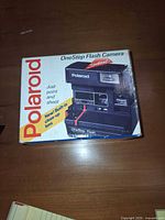 Front of boxed Polaroid OneStep Flash camera