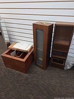 Three cabinets standing upright showing overall condition