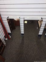 Front view of both mirrored medicine cabinets standing upright