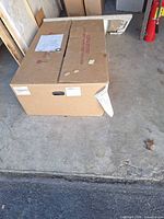 Closed shipping box containing vanity top