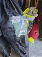 Two black carry bags with Coleman ComfortSmart Suspension Chair tags visible