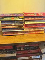 Stacks of Julie Garwood paperbacks and other romances