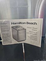 Front branding and manual displayed against stainless steel exterior