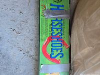 Close view of boxed horseshoe set packaging