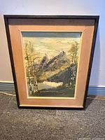 Front view of framed mountain landscape painting