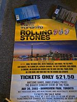Full view of folded concert poster showing headline, Toronto skyline image, band list, ticket price and logos