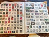 Two album pages titled Canada showing mounted Canadian stamps