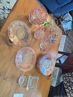 Group view of plates, bowls, snifters, salt cellars on table
