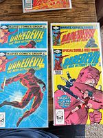 Front covers of four bagged Daredevil comics including #181, two copies of #185 and another issue