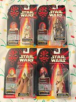 All four sealed Star Wars Episode I figures on cards