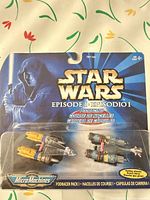 Front view of sealed Star Wars Episode I Podracer Pack showing two miniature podracers in blister