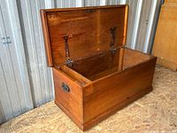 Chest open showing interior and hardware