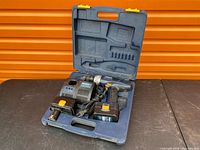 Entire set in open carry case showing drill, charger, batteries