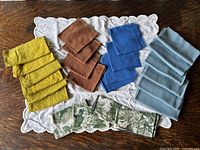 All napkins and tea towel arranged on table