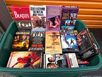 Top view of tote showing several featured VHS covers including Beatles, Clint Eastwood, Led Zeppelin, Young Guns, Spider-Man and others