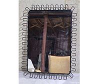 Front view showing wavy loop frame and reflective surface