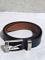 Rolled belt showing texture, buckle and keeper