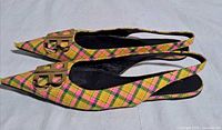 Side view of both shoes showing plaid pattern and BB logo