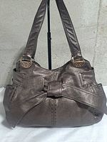 Front view showing bow detail, straps and hardware
