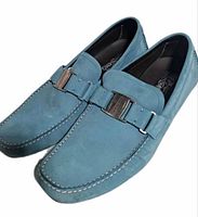 Top angled view of both loafers showing suede upper, bit buckle, stitching