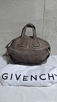 Front view of Givenchy Nightingale bag with dust bag