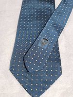 Full view of tie showing pattern and Gucci crest