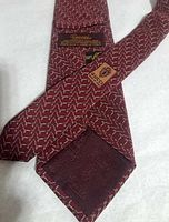 Reverse of tie showing Gucci leather patch and jacquard lining