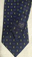 Front view of navy Hermès tie showing geometric pattern
