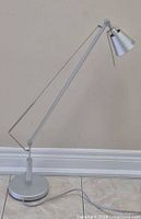 Full view of silver adjustable IKEA Husvik lamp
