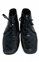 Front view of both shoes showing Damier pattern and lace detail