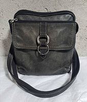 Front view showing flap with ring detail and overall appearance