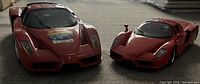 Front three-quarter view showing both Enzo Ferrari models, size comparison and livery details