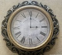 Front view of clock showing dial, numerals, frame