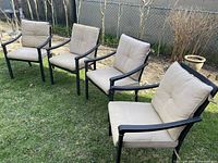 Full set of four patio chairs on lawn