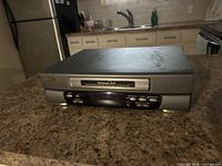 Front view showing tape slot, display, control buttons